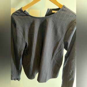 Ganni navy blue pinstripe blouse. Slightly ruffled sleeves.